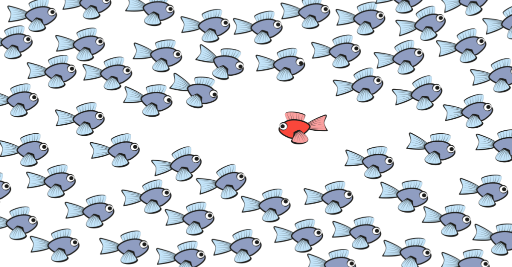 A cartoon orange fish swimming in the opposite direction to a school of grey fish. This depicts how design thinking lets people swim against the current to produce a wealth of ideas and test them. 