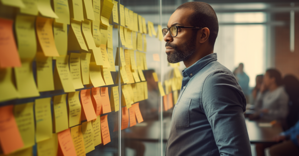 Someone standing confused in front of a project management board due to a lack of clarity